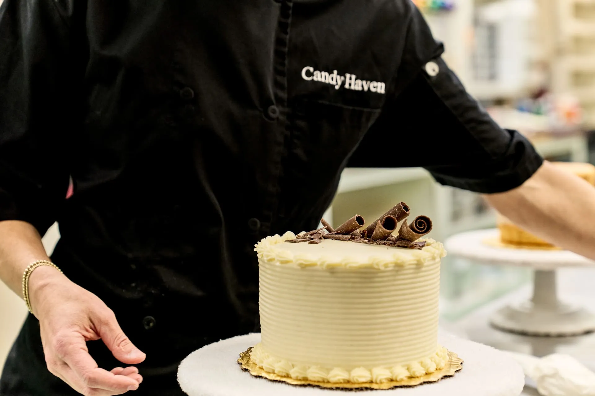 Professional cake decorator creating custom cake designs